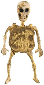 CLASSIC "DEATH TO TRUSTS" MCKINLEY MECHANICAL SKELETON BADGE.