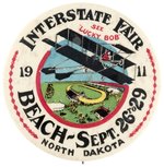 LARGE AND EARLY 1911 AVIATION EXHIBITION BUTTON FROM NORTH DAKOTA PICTURING BARNSTORMER "LUCKY BOB".