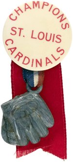 1946 ST. LOUIS CARDINALS WORLD SERIES "CHAMPIONS" BUTTON WITH BASEBALL GLOVE ATTACHMENT.