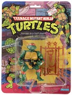 TEENAGE MUTANT NINJA TURTLES (1988) - MICHAELANGELO SERIES 1/10 BACK ACTION FIGURE ON CARD.