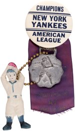 1941 NEW YORK YANKEES "CHAMPIONS AMERICAN LEAGUE" WITH WORLD SERIES RIBBON AND ATTACHMENTS.