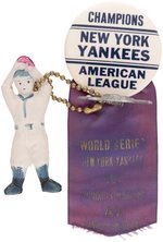 1941 NEW YORK YANKEES "CHAMPIONS AMERICAN LEAGUE" WITH WORLD SERIES RIBBON AND ATTACHMENTS.