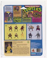 TEENAGE MUTANT NINJA TURTLES (1988) - APRIL O'NEIL SERIES 1/10 BACK AFA 75 Y-EX+/NM (BLUE STRIPES).