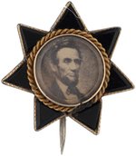 LINCOLN BLACK ONYX DIMINUTIVE SEVEN POINT STAR MEMORIAL BROOCH.