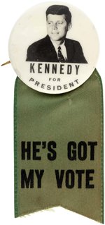 KENNEDY RARE 1960 REAL PHOTO PORTRAIT BUTTON W/"HE'S GOT MY VOTE" RIBBON.