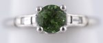 PLATINUM GREEN TSAVORITE GARNET AND DIAMOND RING.