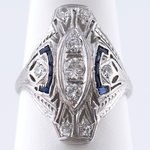 18KT WHITE GOLD ART DECO DIAMOND AND SAPPHIRE RING.