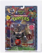 TEENAGE MUTANT NINJA TURTLES: WARRIORS OF THE FORGOTTEN SEWER (1994) - GATEKEEPER ROCKSTEADY (RED ACCESSORIES) AFA 85 NM+.