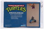 TEENAGE MUTANT NINJA TURTLES (1988) - KNUCKLEHEAD SERIES 1 VEHICLE AFA 80+ NM.