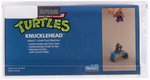 TEENAGE MUTANT NINJA TURTLES (1988) - KNUCKLEHEAD SERIES 1 VEHICLE AFA 80+ NM.