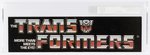 TRANSFORMERS (1985) - SMALL AISLE HANGER SIGN (TRANSFORMERS LOGO) AFA 80 NM.