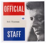 JOHN F. KENNEDY "OFFICIAL STAFF" LAMINATED SERIAL NUMBERED PIN BACK BADGE.