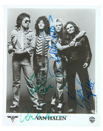 “VAN HALEN” PUBLICITY PHOTO SIGNED BY ALL FOUR ORIGINAL MEMBERS.