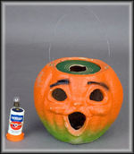 PAPER MACHE JACK-O-LANTERN WITH BATTERY LIGHT INSERT.