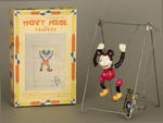 "MICKEY MOUSE ON TRAPEZE" BOXED CELLULOID WIND-UP.