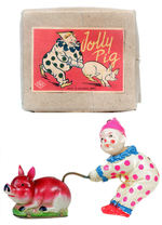 "JOLLY PIG" BOXED WINDUP.