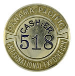 P.P.I.E. SERIALLY NUMBERED "CASHIER" BADGE.