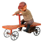 BOY ON IRISH MAIL WIND-UP TOY.