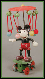 MICKEY MOUSE CELLULOID WIND-UP CAROUSEL TOY.