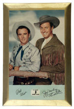 "DICK WEST/JACK MAHONEY RANGE RIDER/TV GUIDE COWBOY ALBUM" CELLULOID-COVERED WALL PLAQUE.