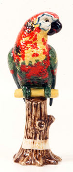 "POLL PARROT SHOES" GLAZED CERAMIC FIGURE.