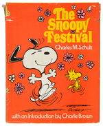 CHARLES SCHULZ SIGNED COPY OF “THE SNOOPY FESTIVAL” BOOK WITH SNOOPY SKETCH.