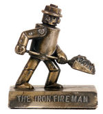 "THE IRON FIREMAN" FURNACE COMPANY FIGURAL PAPERWEIGHT.