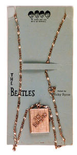 “THE BEATLES” FLIP-OUT LOCKET NECKLACE.