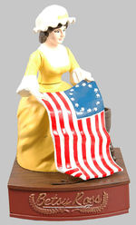 "BETSY ROSS" LIMITED EDITION MECHANICAL BANK WITH PROMOTIONAL FOLDER.