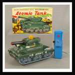 "BATTERY OPERATED ATOMIC TANK WITH SHOOTING DISKS."