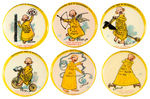 YELLOW KID BUTTON NUMBERS 17, 20, 21, 23, 24, 26.