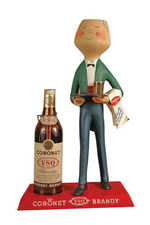 "CORONET BRANDY" FIGURAL BOTTLE DISPLAY.