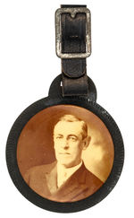 WILSON SEPIA REAL PHOTO CELLULOID MOUNTED ON FIBERBOARD WATCH FOB COMPLETE WITH STRAP.