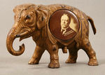 TAFT METAL ELEPHANT WITH INSERT BUTTON.