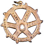 "CHAMPION HARVESTING MACHINE" BRASS CHARM.