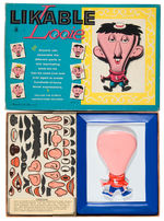 “LIKABLE LOOIE” FACE CHANGING TOY.