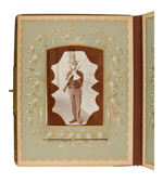 FABULOUS 1898 ERA PHOTO ALBUM WITH CELLULOID FRONT COVER DEPICTING TR IN HIS ROUGH RIDER UNIFORM.