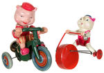 CELLULOID PIGS WIND-UP TOY PAIR.