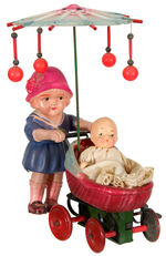 GIRL PUSHING BABY CARRIAGE CELLULLOID WIND-UP.