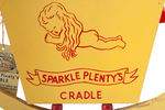 DICK TRACY CHARACTER "SPARKLE PLENTY'S CRADLE" WITH STRING TAG.