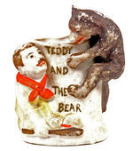 "TEDDY AND THE BEAR" BISQUE FIGURINE.