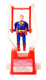 “SUPERMAN TRICKY TRAPEZE PUSH BUTTON ACROBAT.