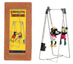 "SWINGING EXHIBITION FLIGHTS" BOXED WINDUP TOY FEATURING MICKEY & MINNIE MOUSE.