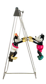 "SWINGING EXHIBITION FLIGHTS" BOXED WINDUP TOY FEATURING MICKEY & MINNIE MOUSE.