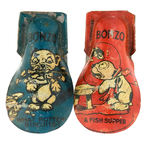 “BONZO” PAIR OF CAPTIONED LITHO TIN CLICKERS.