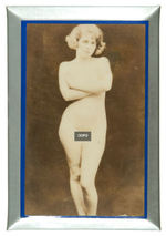 CELLULOID-COVERED PLAQUES FEATURING PHOTOS OF NUDE FEMALE MODELS.