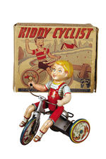 "UNIQUE ART KIDDY CYCLIST" WIND-UP.