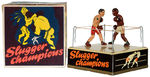 “SLUGGER CHAMPIONS” BOXED BOXING WIND-UP TOY.