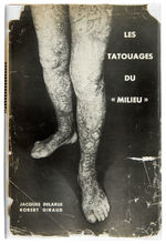 1950 EXTENSIVELY ILLUSTRATED FRENCH TATTOO BOOK WITH DUST WRAPPER.