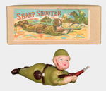 “SHARPSHOOTER” CELLULOID SOLDIER BOXED WINDUP.